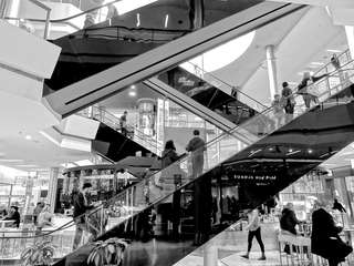 Image for the poem Watching from a Coffee Table at the Mall