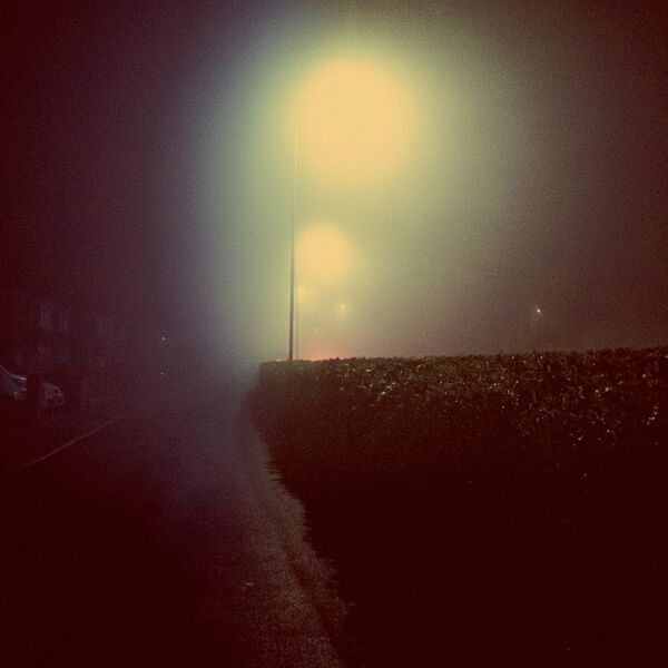 Image for the poem 4.30am ~ room view of a motel car park